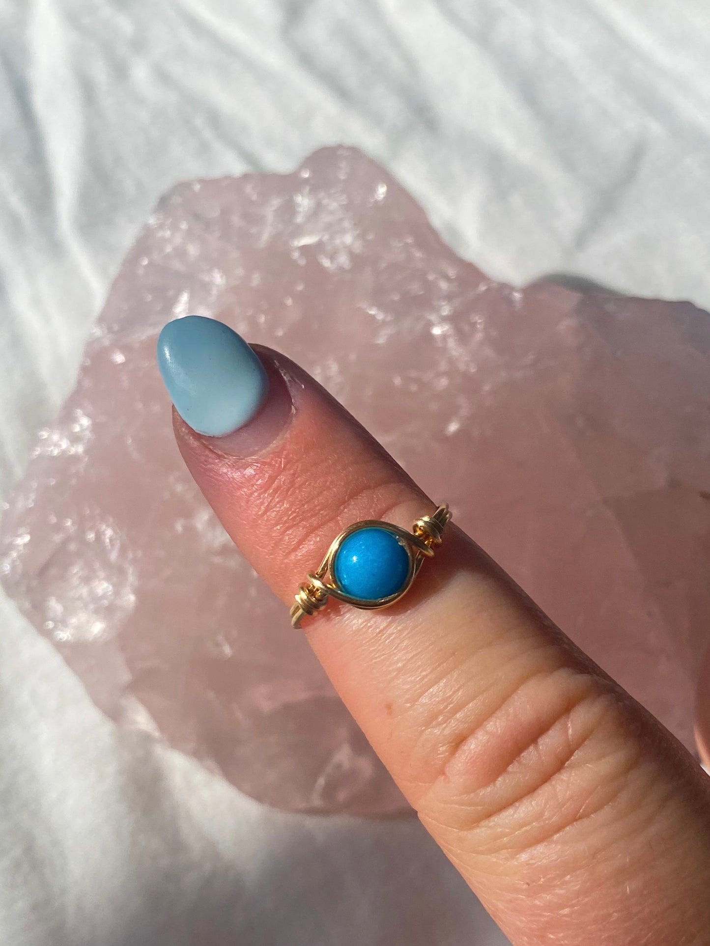 Gold blue intention ring